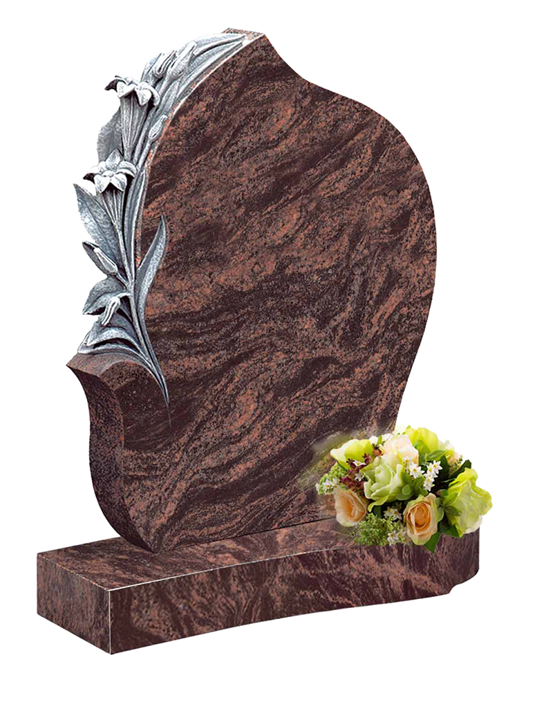 Orange/brown headstone with carved flowers